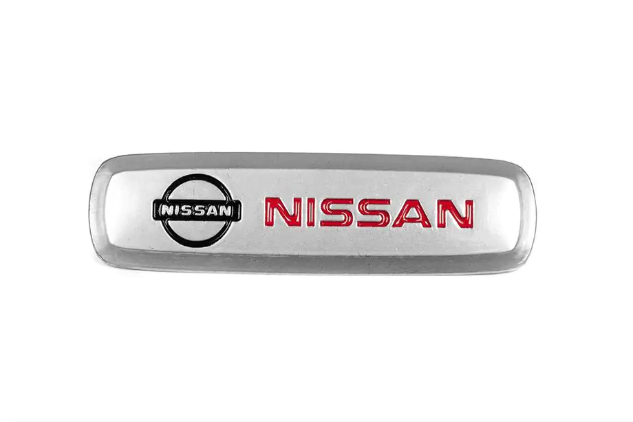 Nissan Aluminium Emblem für Fußmatten (1 Stk) Foto 1