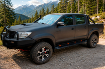 Toyota Hilux 2006-2015 Seitenstufen Dakar Schwarz V1 mit Beleuchtung (2 Stk, Metall) Foto 1